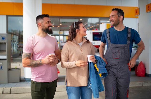 People spending time at the gas station