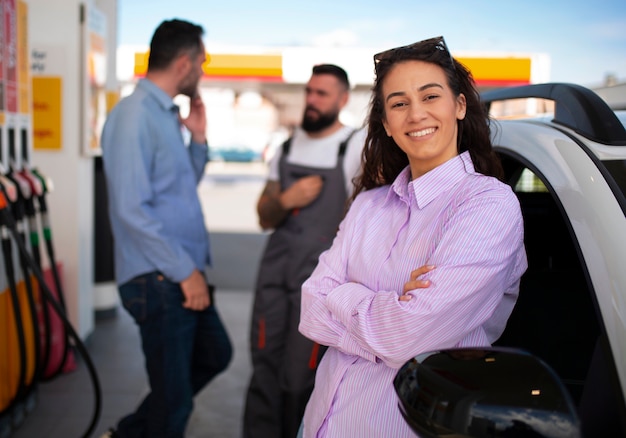 Free photo people spending time at the gas station