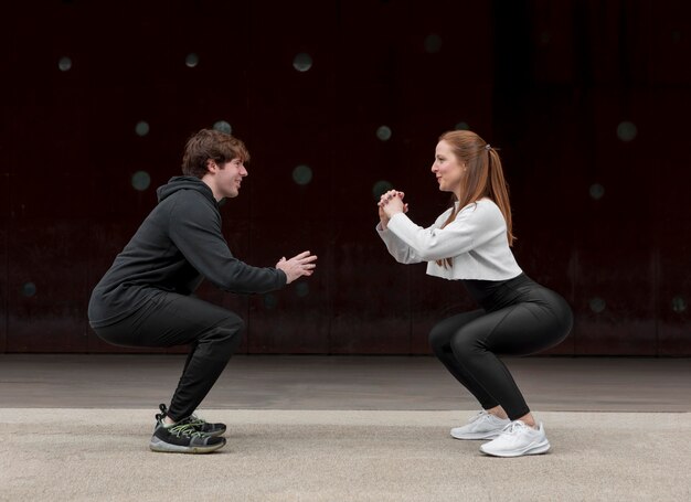 People in sportswear exercising outdoors