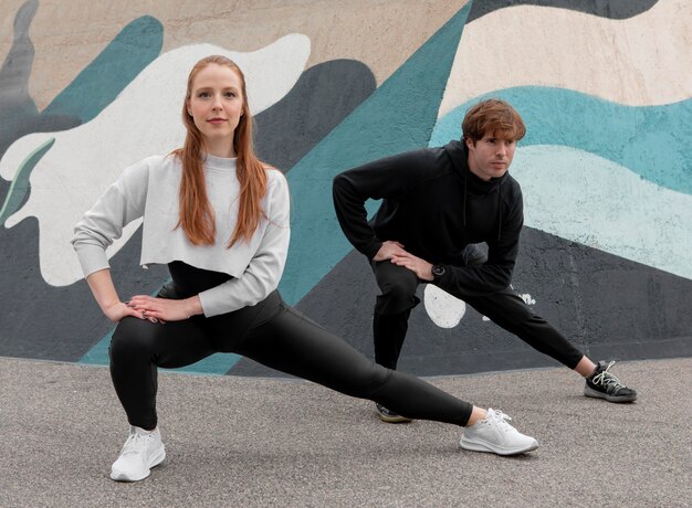 People in sportswear exercising outdoors