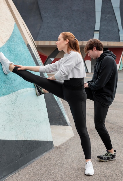 People in sportswear exercising outdoors