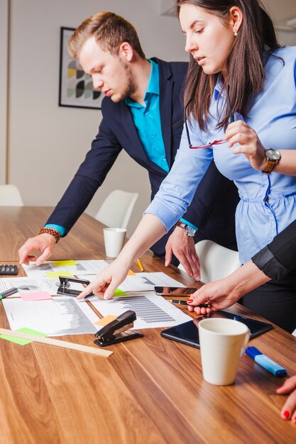 People standing at desk working