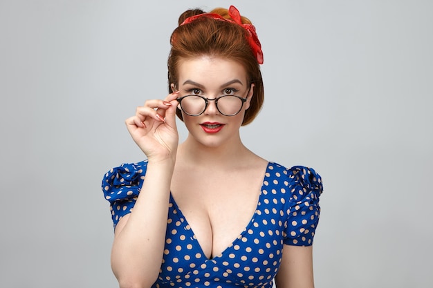 https://img.freepik.com/free-photo/people-style-fashion-optics-eyewear-isolated-shot-gorgeous-pin-up-girl-model-low-cut-dress-advertising-spectacles-studio-holding-hand-stylish-eyeglasses-smiling-camera_343059-668.jpg