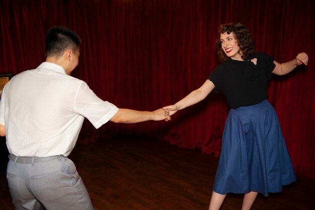 People swing dancing medium shot