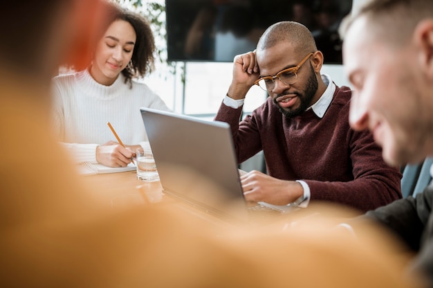 People at the table in the office during a meeting