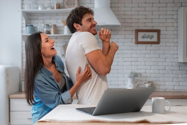 Free photo people tickling each other