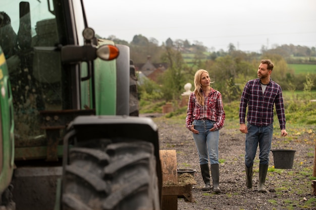 Free photo people next to tractor