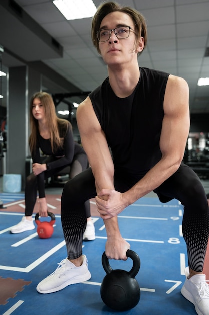 People training together with weight lifting