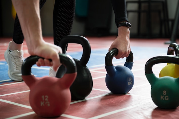 People training together with weight lifting