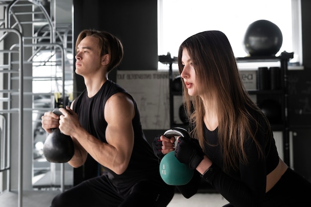 People training together with weight lifting