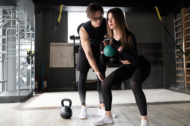 People training together with weight lifting