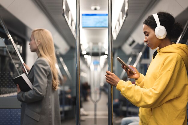 people traveling on the subway in winter time