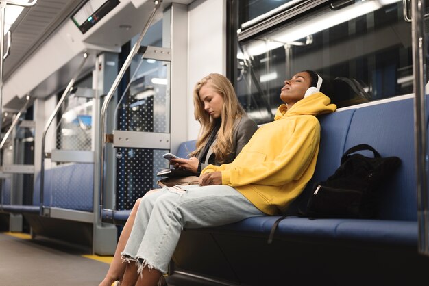 people traveling on the subway in winter time