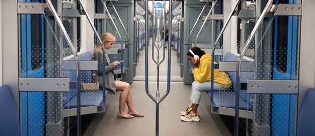 Free photo people traveling on the subway in winter time