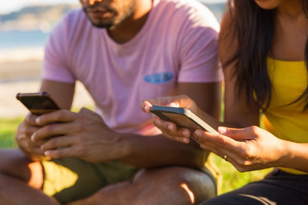 People using mobile phones in park