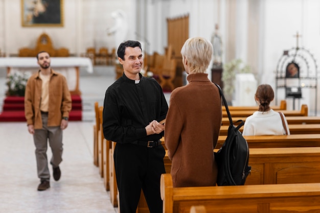 People visiting and praying in church building