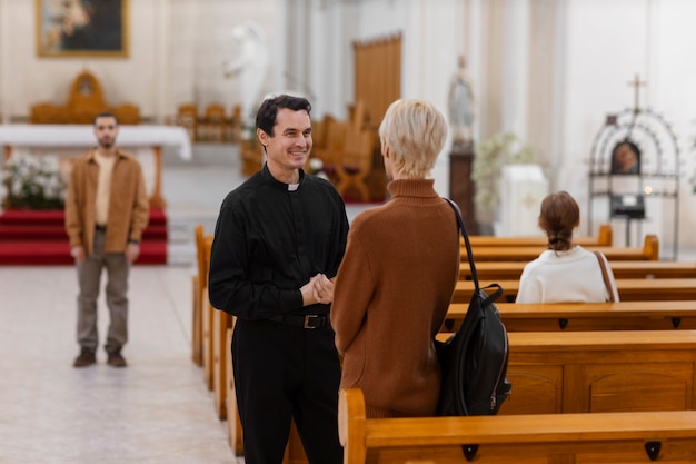 People visiting and praying in church building