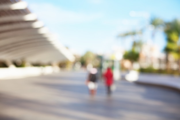 People walking on a paved street