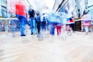 Free photo people walking in a shopping mall