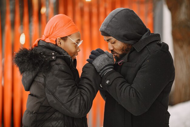 Free photo people walks outside. winter day. african couple.