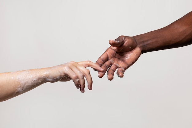 People washing hands with soap