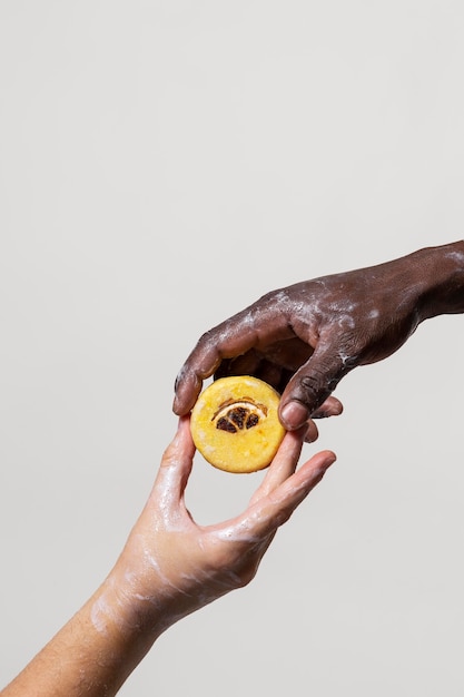 People washing hands with soap