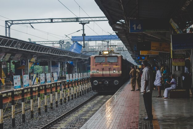 People watching as a train approaches