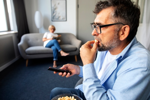 Free photo people watching news on tv