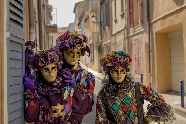 People wearing colorful masks and clothes during the carnival