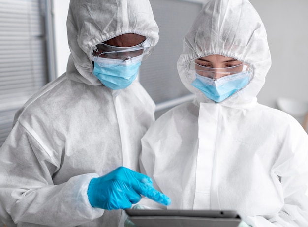 People wearing protective suit in a biohazard area