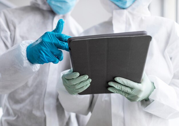 People wearing protective suit in a biohazard area