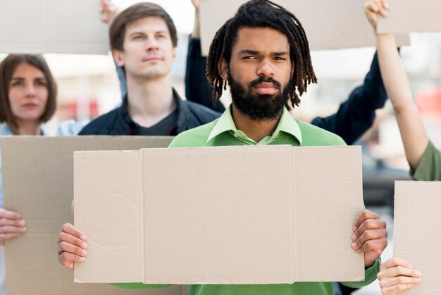 people with cardboards black lives matter concept