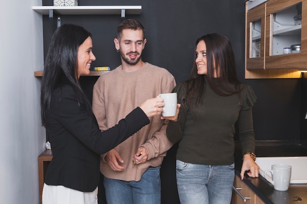 People with cups in office