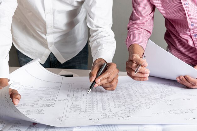 People working on blueprint of a city