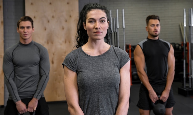 People working out indoors together with dumbbells