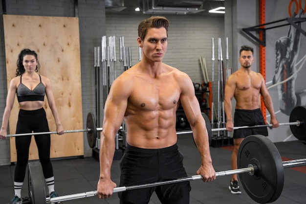 People working out indoors together with weights