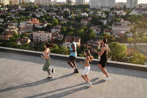 people working out together at sunset outdoors