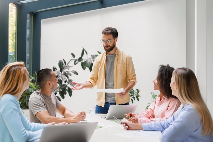 Free Photo people working in tech brand together