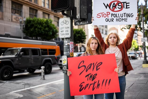 People at a world environment day protest outdoors with placards