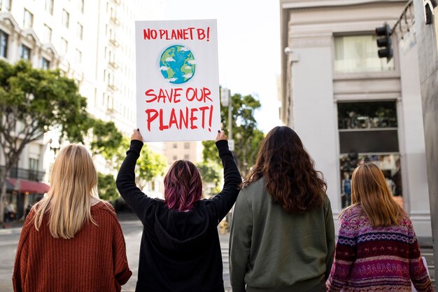 People at a world environment day protest with placards outdoors