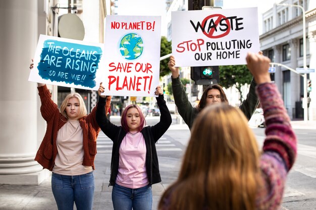 people at a world environment day protest with placards outdoors
