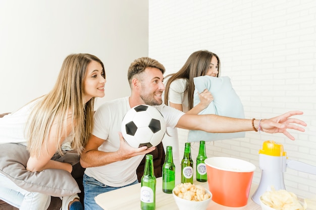 People worrying watching football game at home