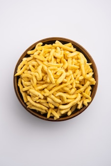Pepper sev mota shev, south indian snacks consisting of small pieces of crunchy noodles made from chickpea flour or besan paste, which are seasoned with turmeric