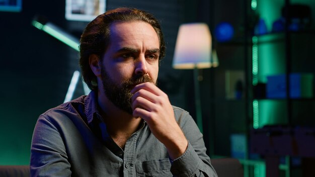 perplexed man watching unconvincing team performance sports match on tv