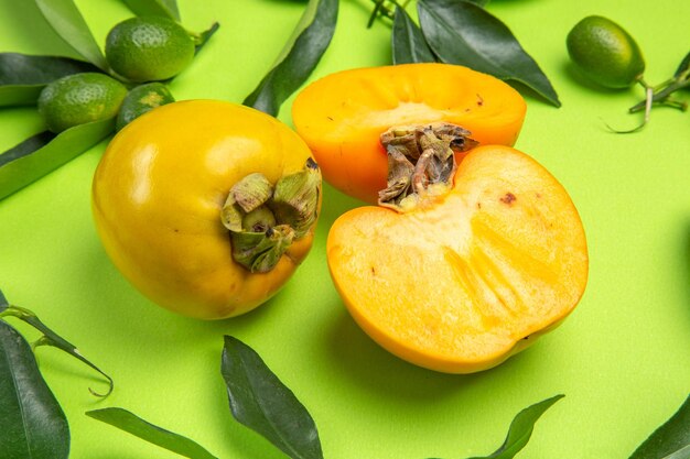 persimmon citrus fruits with leaves and three persimmons