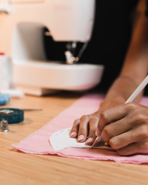 Person and blurred sewing machine