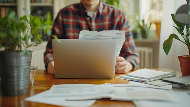 Free photo person calculating tax returns at home with documents and a laptop