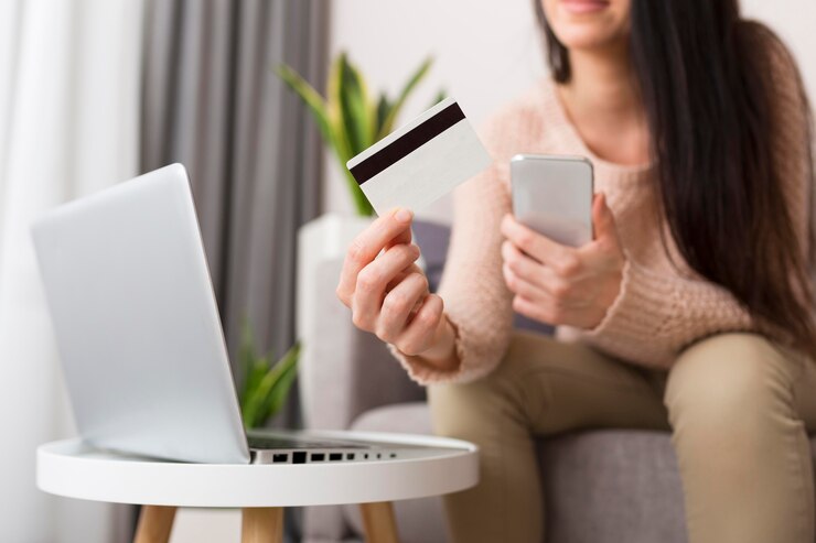 Free Photo person checking her laptop for sales