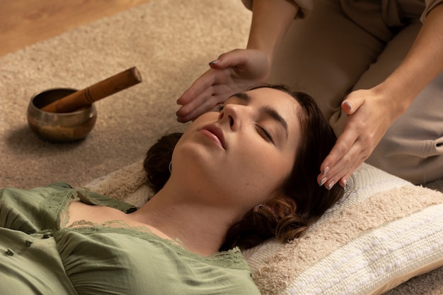 Free photo person conducting reiki therapy