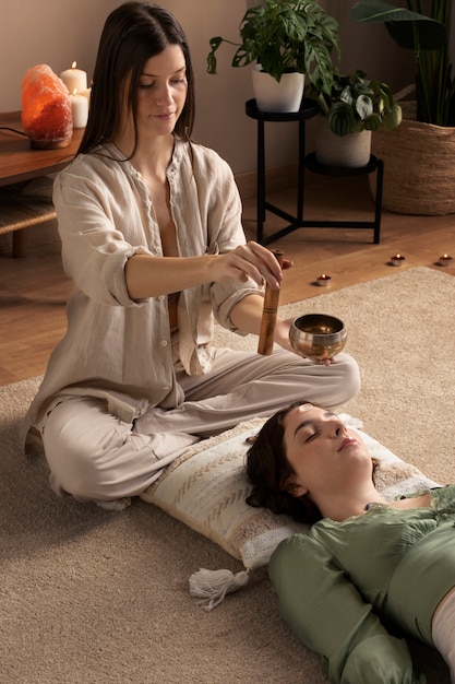 Free photo person conducting reiki therapy